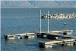 Dock in Harbor Area With Mountain Range in Background
