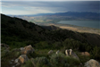 Grassy Mountain And View of Lake and Mountain Range