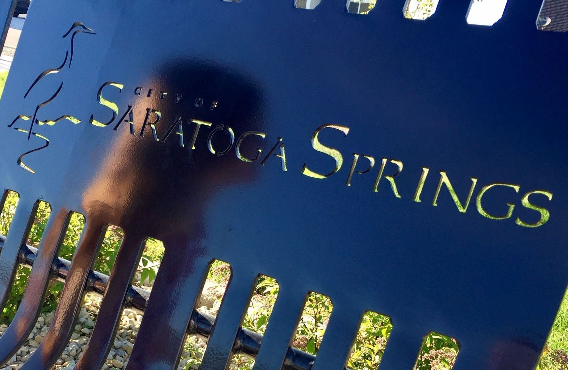Reflection of a girl on a park bench