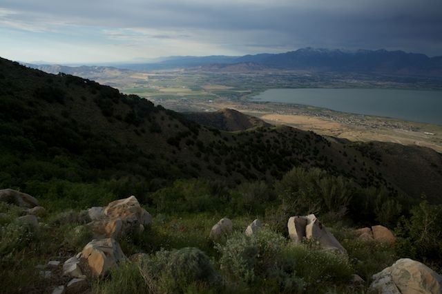 Grassy Mountain And View of Lake and Mountain Range