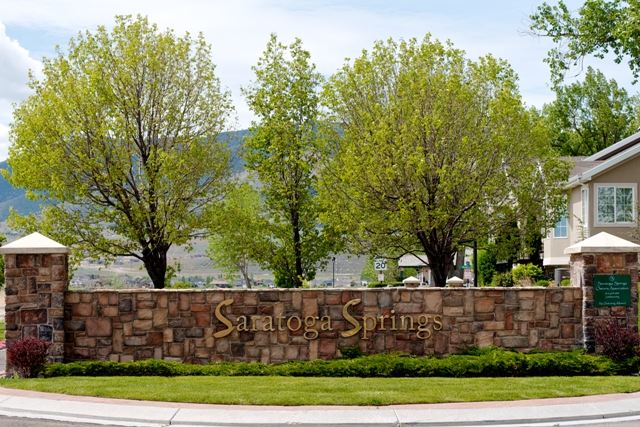 Saratoga Springs Sign With Trees in Background