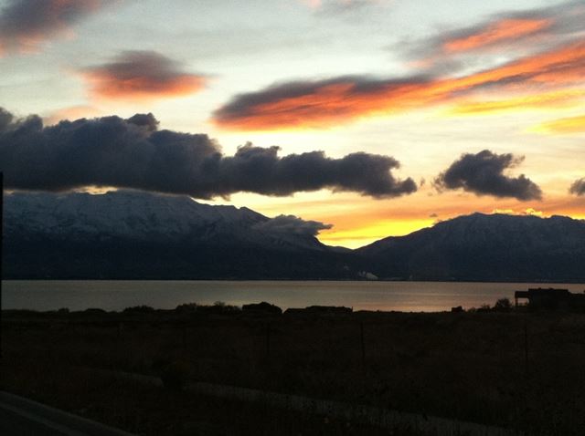 Sun Setting Over Mountain Range